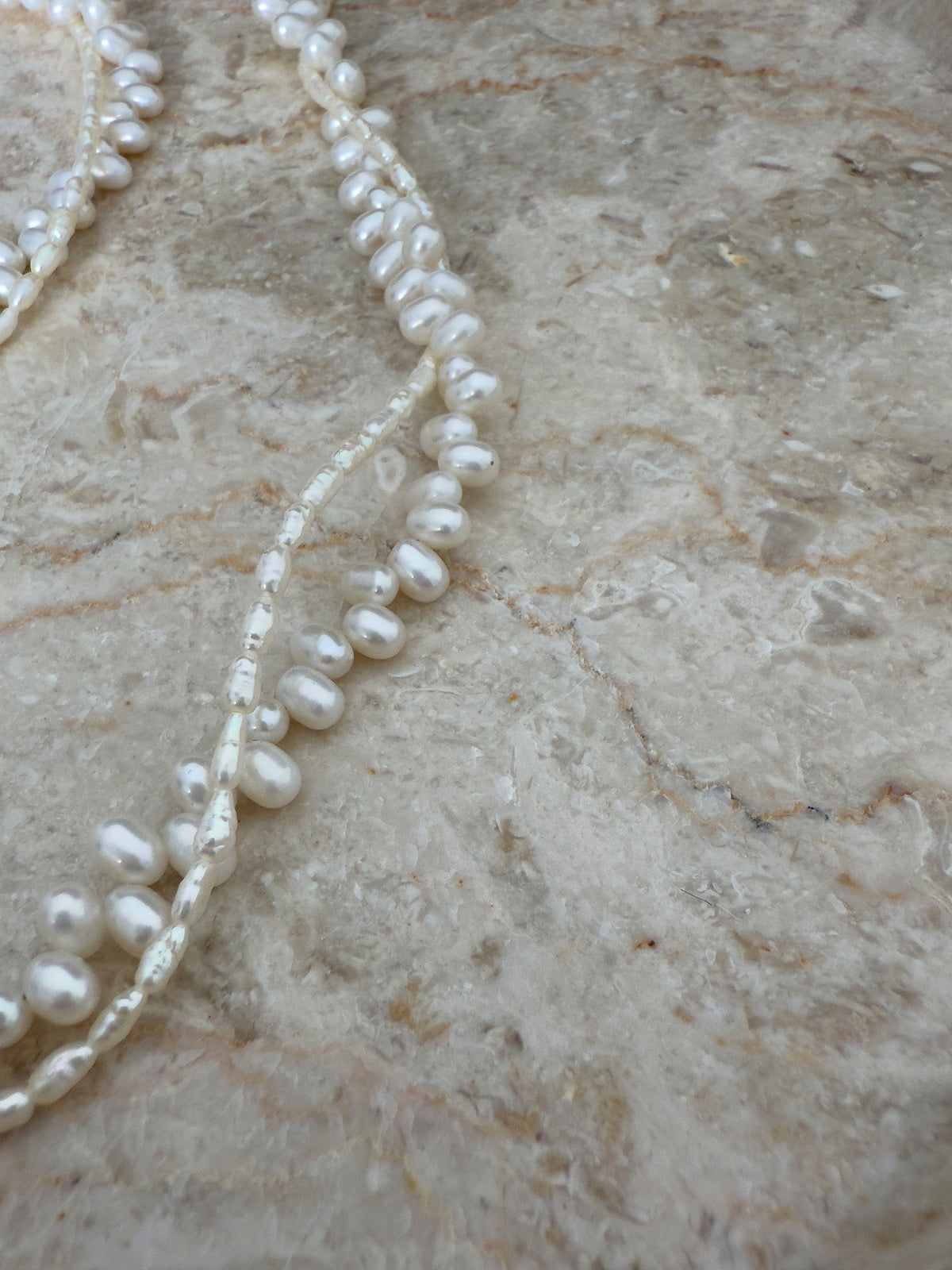 Hand-knotted twisted pearl necklace with two freshwater pearl strands