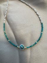 Turquoise and pearl evil eye necklace with gold accents